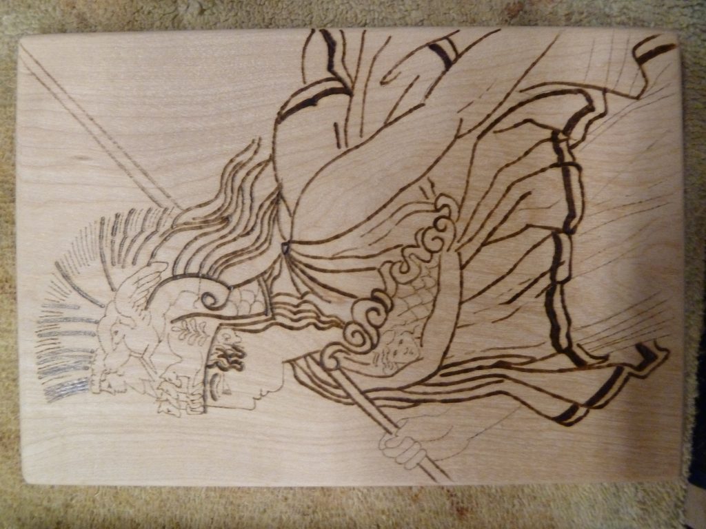 A closer view of one of the woodburned images of Athena.